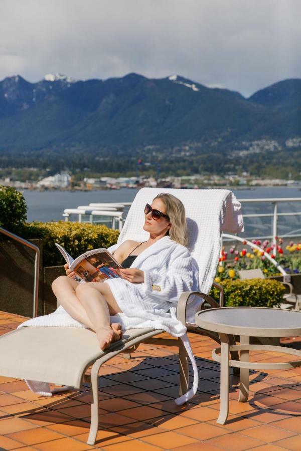 Pan Pacific Vancouver Exterior photo A woman relaxing on a cruise ship